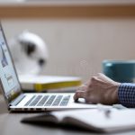 person-working-laptop-computer-954095261